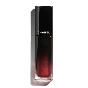 Chanel lipstick with black case on a white background