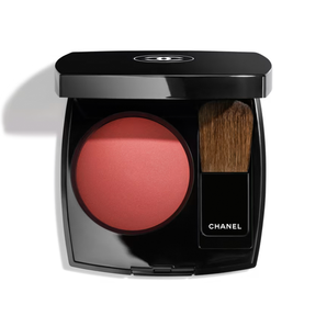 Chanel makeup compact with blush and brush on a white background