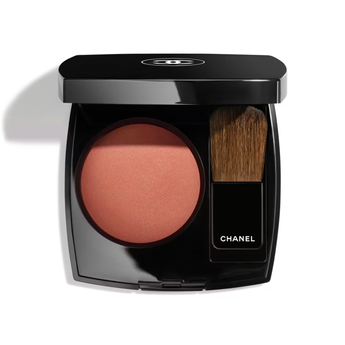 Chanel makeup compact with blush and brush on a white background