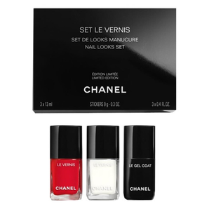 Chanel nail polish set with three bottles and a black box on a white background
