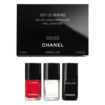 Chanel nail polish set with three bottles and a black box on a white background