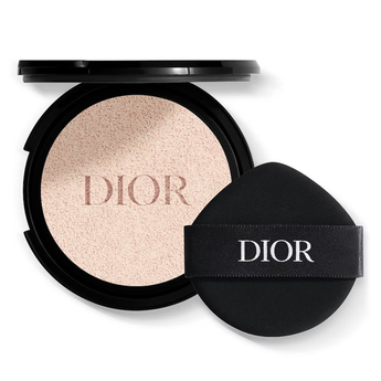 Dior makeup compact with powder and black case on a white background