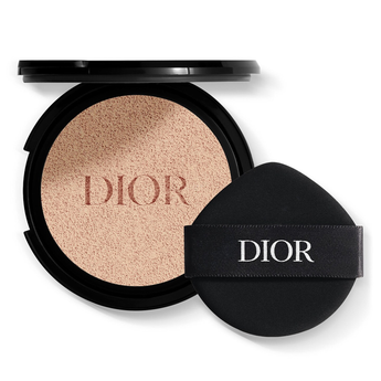 Dior makeup compact with beige powder and black case on a white background