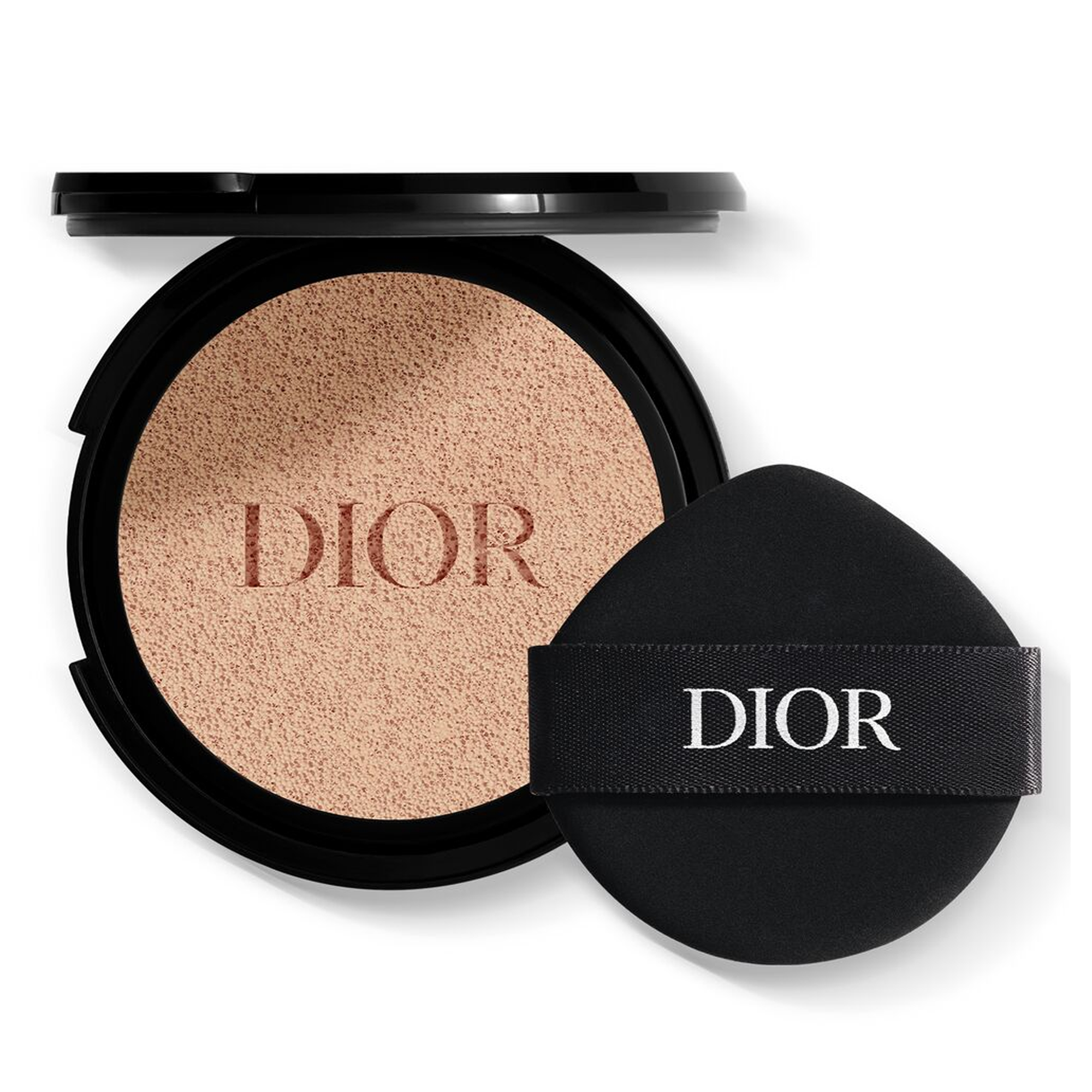 Dior makeup compact with beige powder on a white background