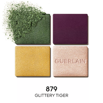 Four Guerlain eyeshadow pans in green, purple, gold, and rose with '879 Glittery Tiger' text.