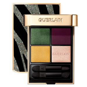 Guerlain eyeshadow palette with four colors and applicators with a white background