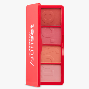 Makeup palette with four shades of blush in a red case on a white background